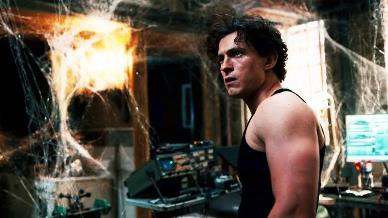 Peter Parker in his sparse apartment, surrounded by webbing