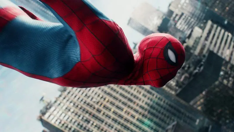 Spider-Man nose-diving into action above New York in his new suit