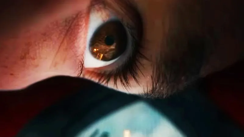 An extreme close-up of Peter Parker's eye inside the Spider-Man mask